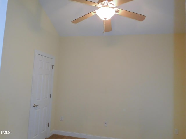 unfurnished room featuring ceiling fan and lofted ceiling