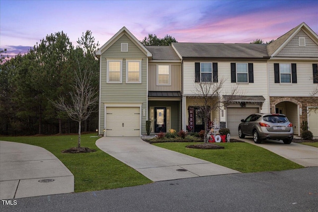 view of front facade featuring a garage and a lawn