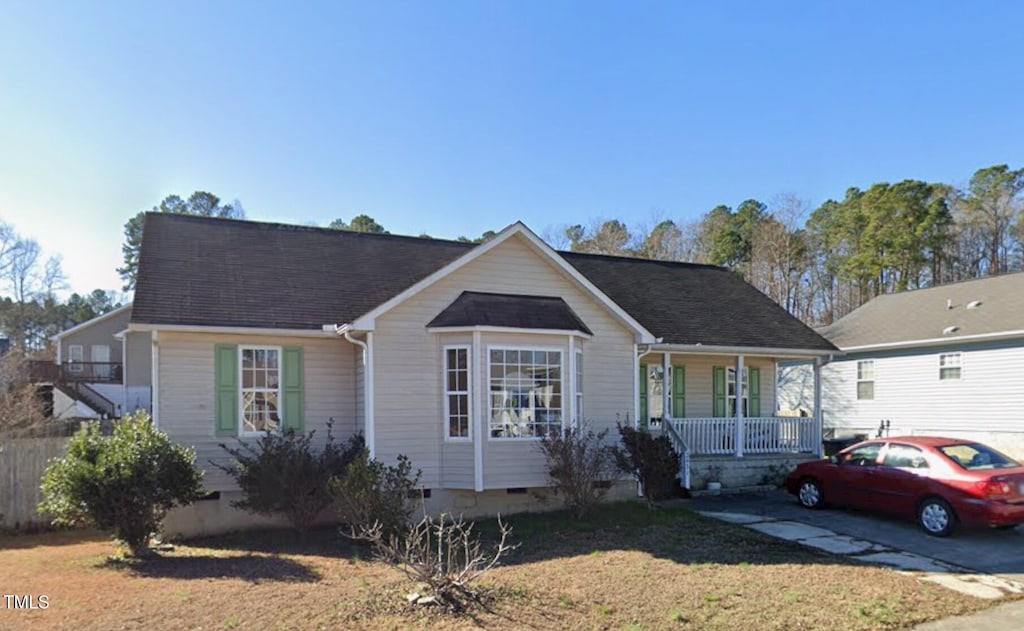 view of front of home featuring a front yard and a porch