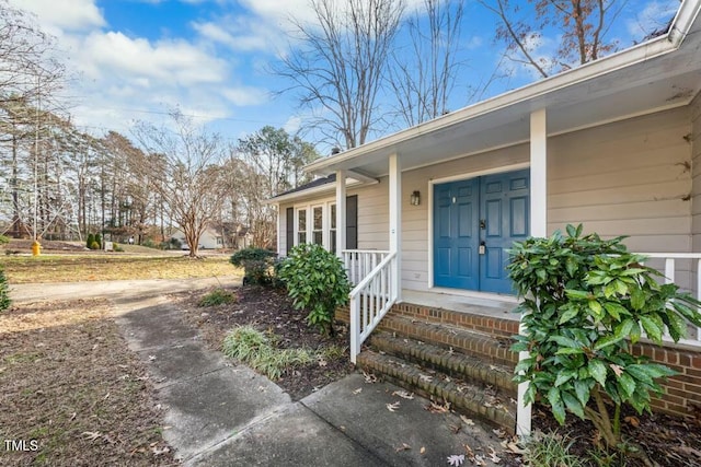 doorway to property with covered porch