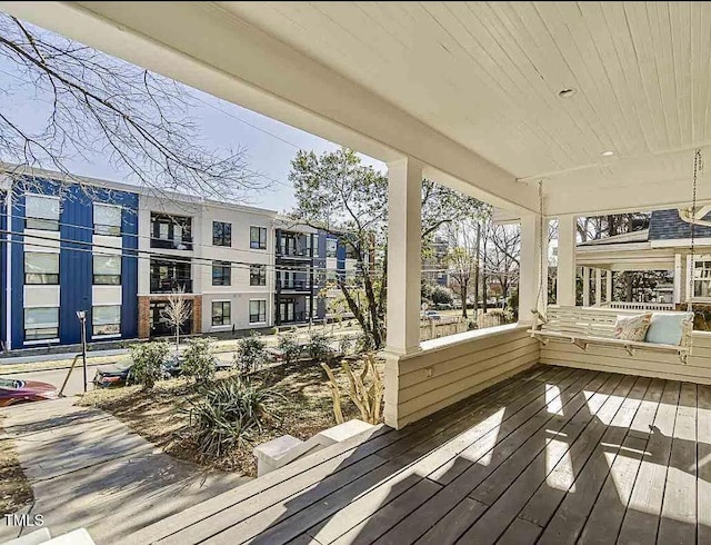 wooden terrace with a porch