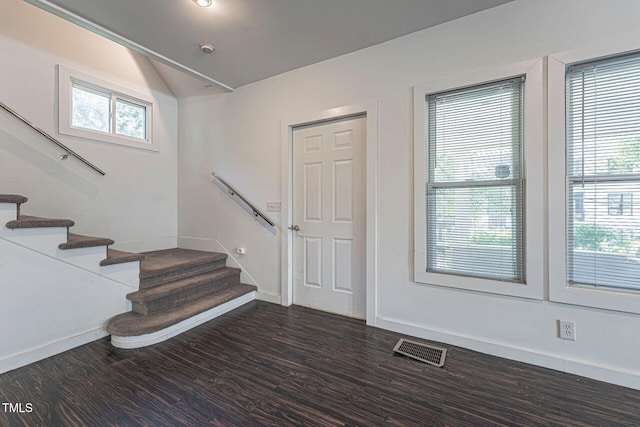 entrance foyer with dark hardwood / wood-style flooring