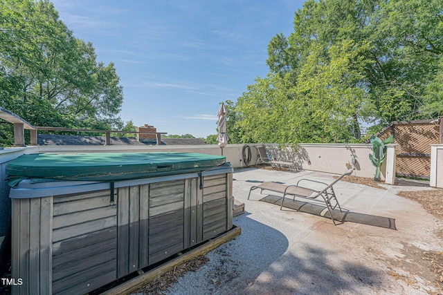 view of patio / terrace with a hot tub