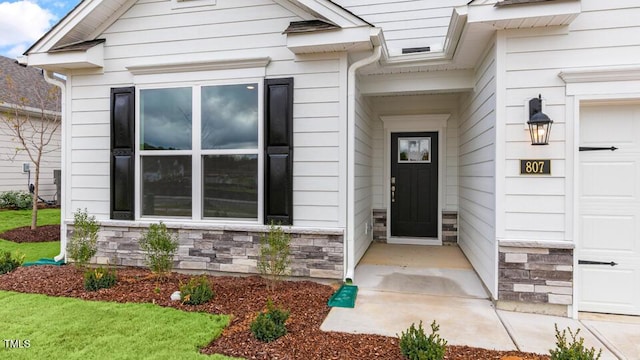 property entrance with a garage