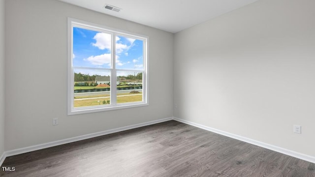 unfurnished room featuring dark hardwood / wood-style floors