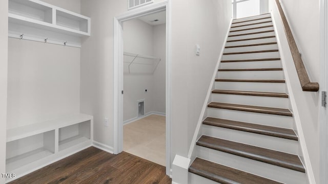 mudroom with dark hardwood / wood-style floors