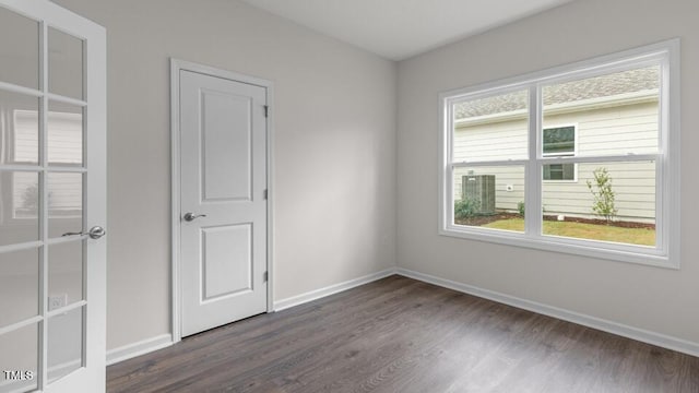 empty room featuring dark hardwood / wood-style flooring