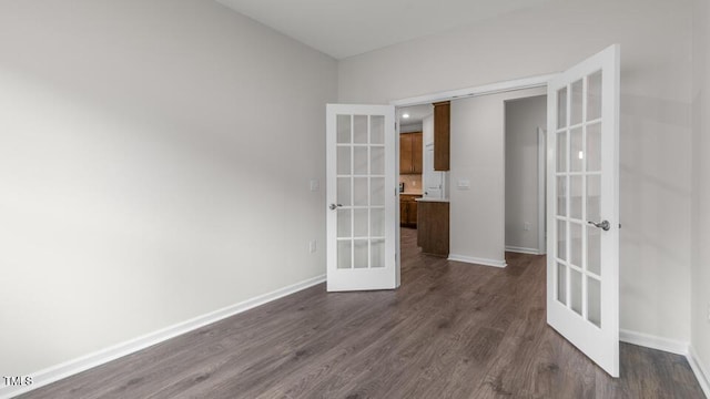 unfurnished room with french doors and dark hardwood / wood-style floors