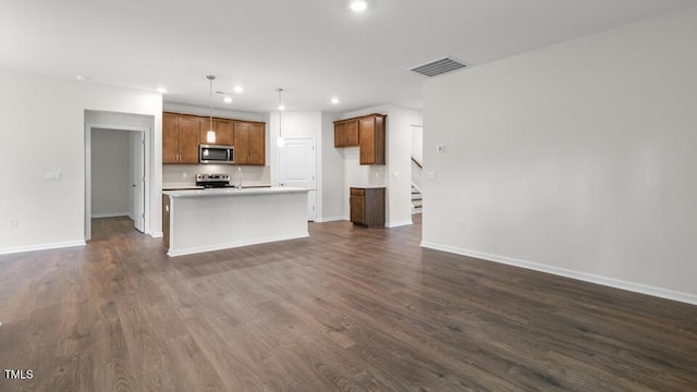 unfurnished living room featuring dark hardwood / wood-style floors