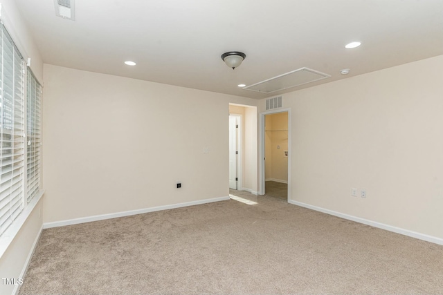 unfurnished room with light carpet