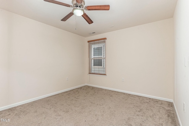 empty room with light colored carpet and ceiling fan