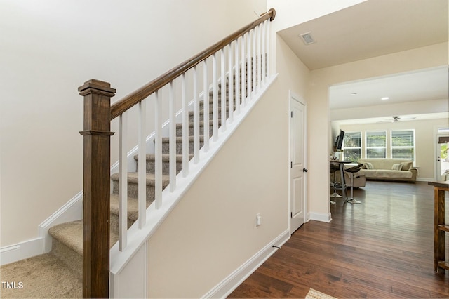 stairway with wood-type flooring