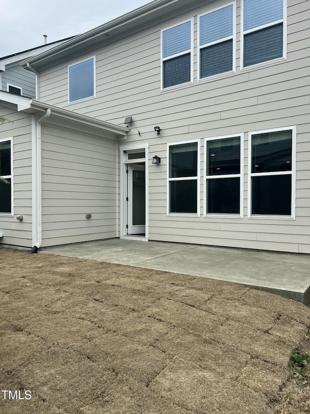 rear view of house featuring a patio area