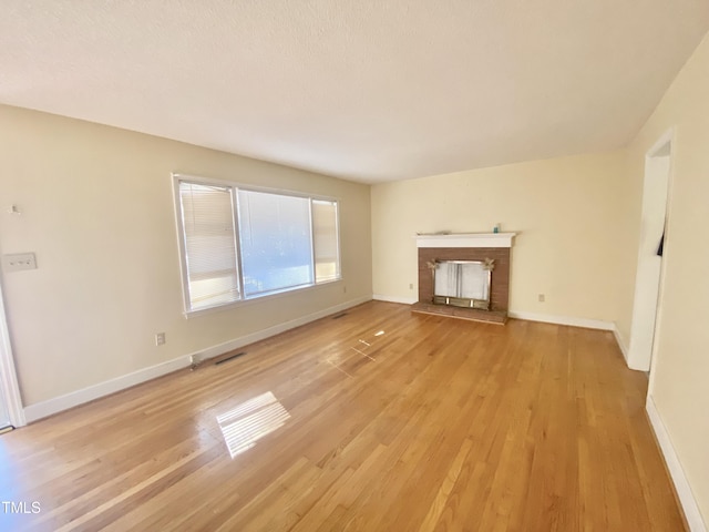 unfurnished living room featuring light hardwood / wood-style flooring