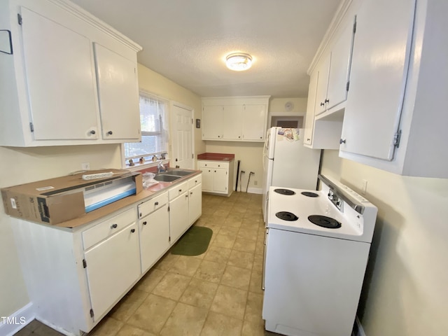 kitchen featuring a textured ceiling, sink, white cabinets, and white appliances