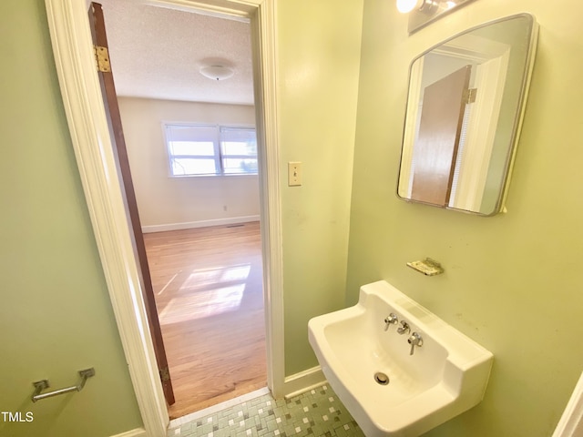 bathroom with a textured ceiling