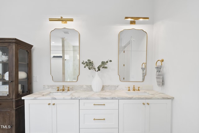 bathroom with vanity and walk in shower