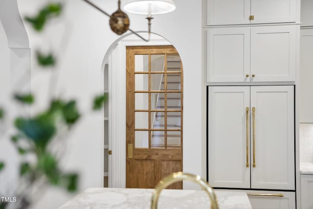 interior details with paneled built in fridge