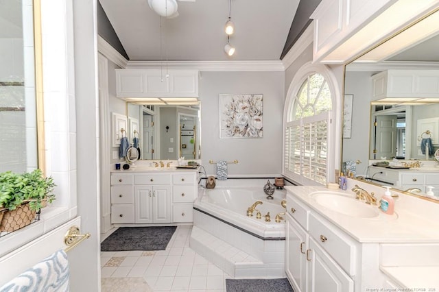 bathroom with crown molding, tile patterned floors, a sink, and a garden tub