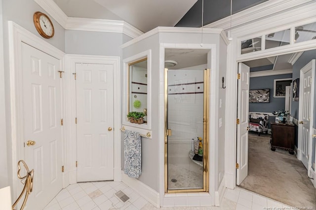 full bathroom with a shower stall, tile patterned floors, baseboards, and ornamental molding