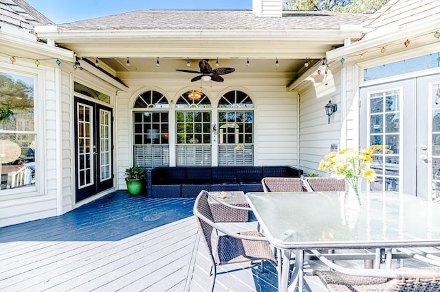 deck featuring an outdoor living space, french doors, a ceiling fan, and outdoor dining space