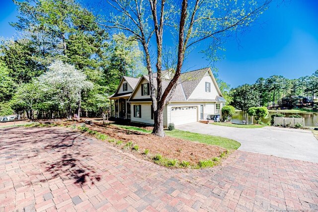 view of front of home featuring a garage and concrete driveway