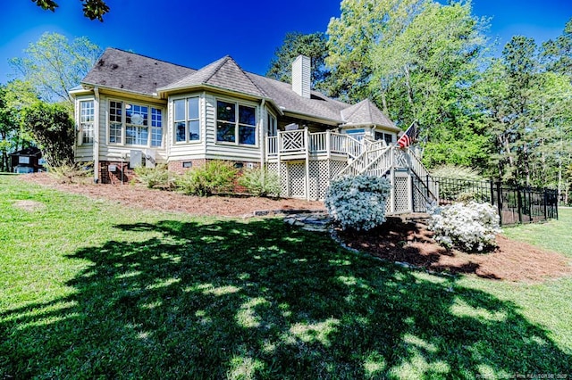 2648 Buckingham Dr, Sanford, NC 27330 - back of property with stairway, crawl space, a chimney, a deck, and roof with shingles