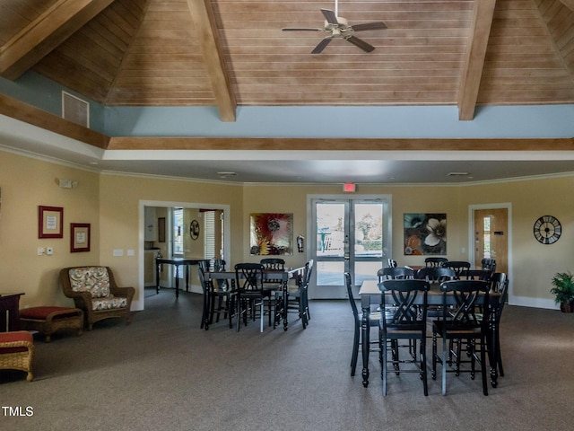 dining space featuring wooden ceiling, carpet flooring, and beam ceiling