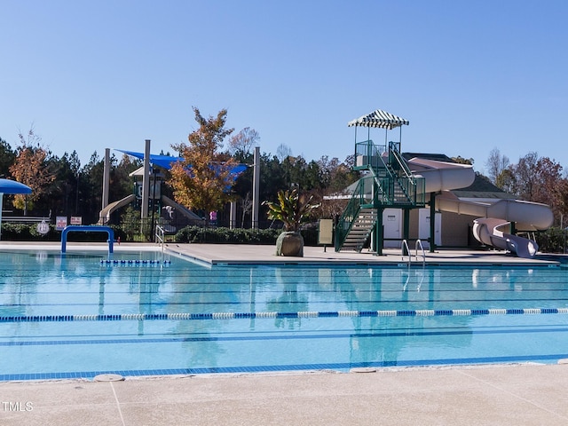 community pool with playground community and a water slide