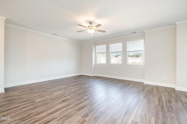 spare room with ceiling fan, dark hardwood / wood-style floors, and crown molding