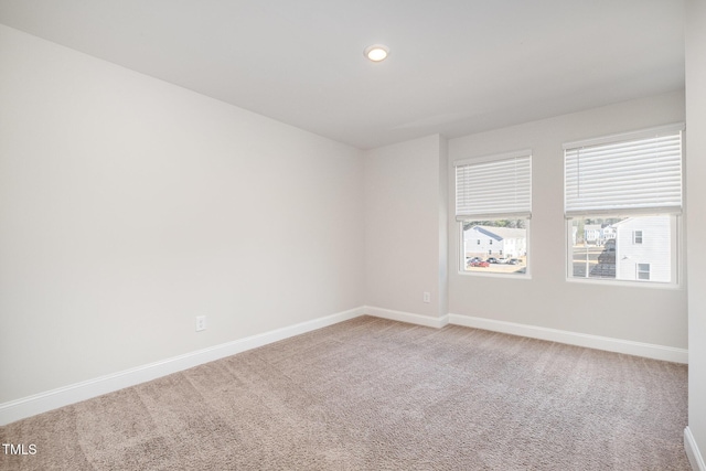 unfurnished room with carpet floors