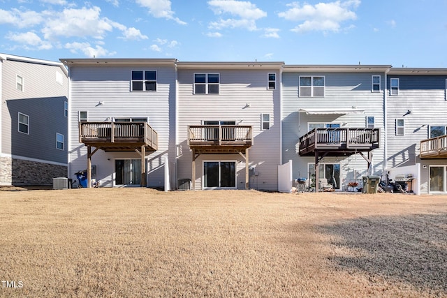 rear view of property featuring central AC