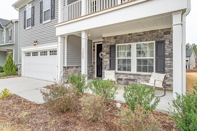 view of front of home with a balcony and a garage