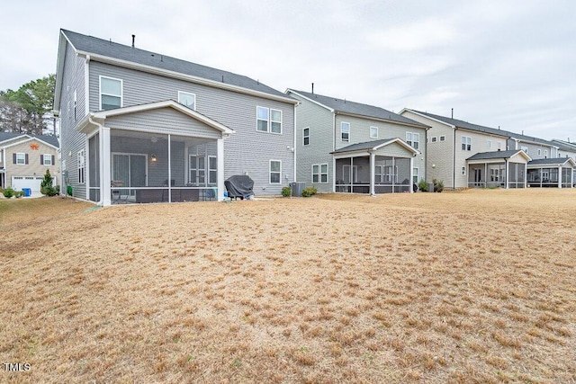 back of property featuring a sunroom