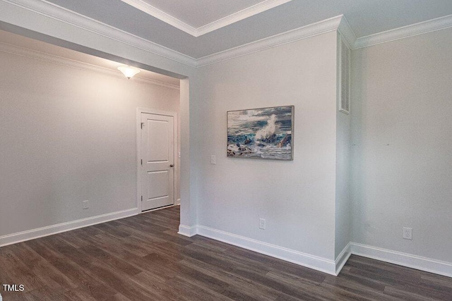 unfurnished room with ornamental molding and dark wood-type flooring