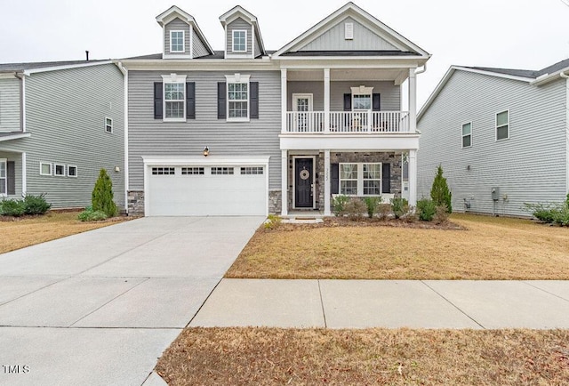 view of front of house featuring a balcony and a garage