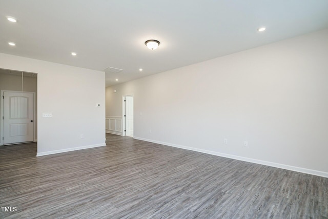 unfurnished room featuring dark hardwood / wood-style flooring