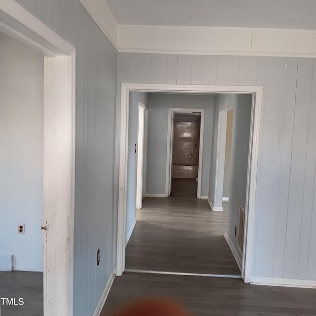 corridor featuring dark hardwood / wood-style flooring