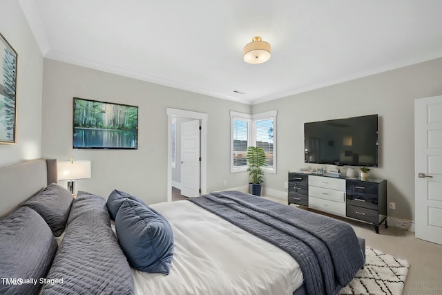 bedroom with light carpet and crown molding