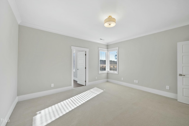 unfurnished bedroom with light colored carpet and crown molding