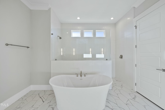 bathroom featuring plus walk in shower and tile walls