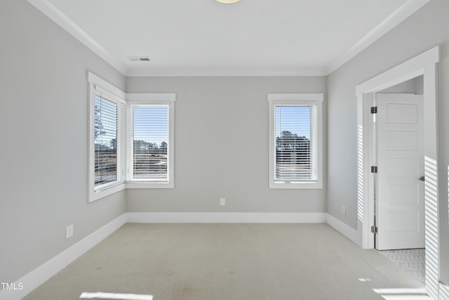 carpeted spare room with ornamental molding