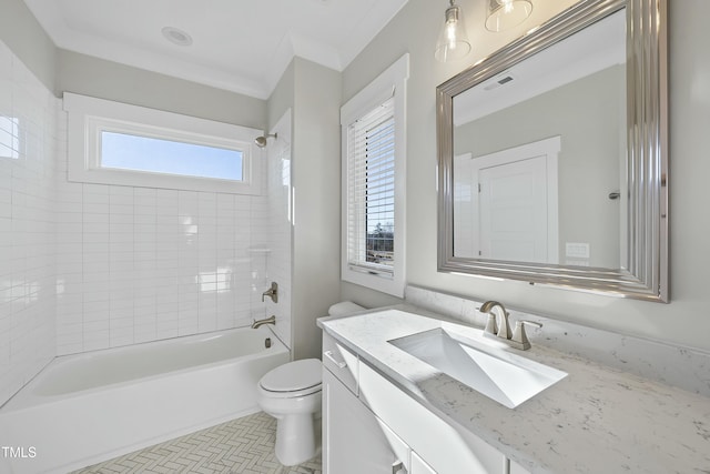 full bathroom featuring vanity, tile patterned floors, crown molding, tiled shower / bath combo, and toilet