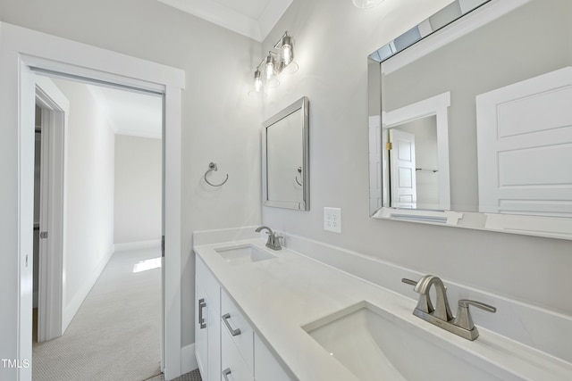 bathroom with vanity and ornamental molding