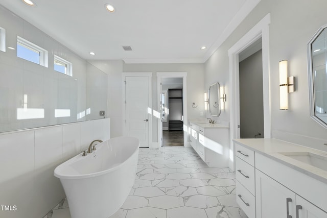 bathroom with plus walk in shower, vanity, and tile walls