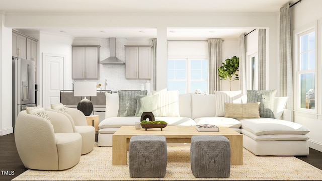 living room featuring sink, wood-type flooring, and crown molding