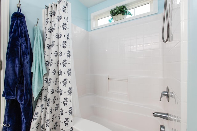 bathroom featuring shower / bathtub combination with curtain