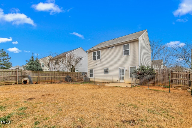 rear view of house featuring a patio