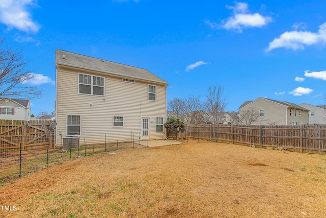 back of property featuring central AC unit and a patio area