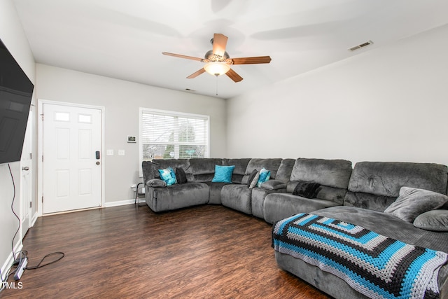 living room with dark hardwood / wood-style floors and ceiling fan